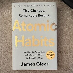 Atomic Habits by James Clear - White and Gold Cover